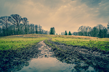 Image showing Muddy road with a puddle