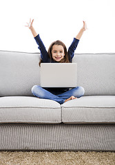 Image showing Little girl working with a laptop