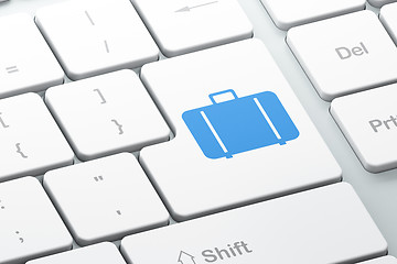 Image showing Tourism concept: Bag on computer keyboard background