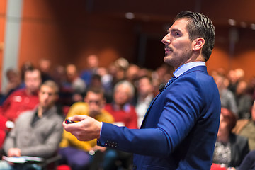 Image showing Public speaker giving talk at Business Event.