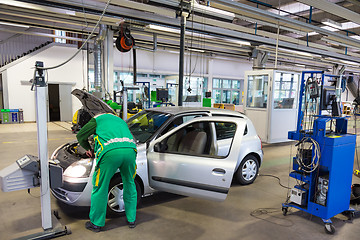 Image showing Car waiting for technical review in garage.