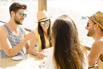 Image showing Friends at the beach bar