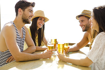 Image showing Friends at the beach bar