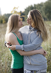 Image showing Two loving sisters comforting each other