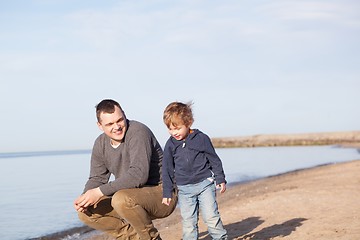 Image showing Father with his young son at the beach