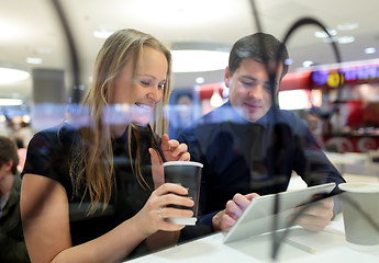 Image showing Man and woman during coffee break with pad