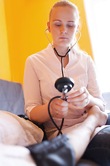 Image showing Nurse with stethoscope - blood pressure