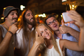 Image showing Happy selfie of friends at night