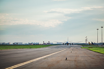 Image showing Airplane taxing on the runway