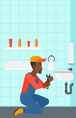 Image showing Man repairing sink.