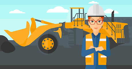 Image showing Miner with mining equipment on background.