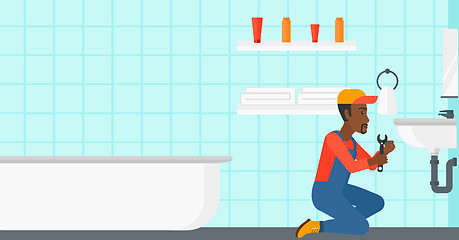 Image showing Man repairing sink.