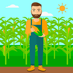 Image showing Farmer holding corn.