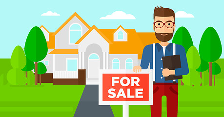 Image showing Real estate agent offering house.