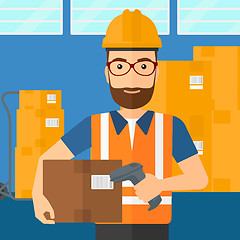 Image showing Worker checking barcode on box.