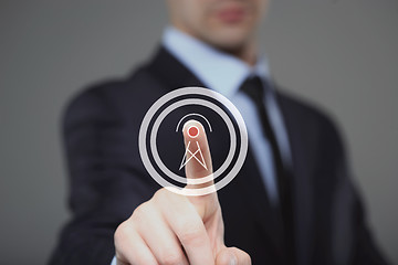 Image showing businessman presses radio tower icon . business and technology concept