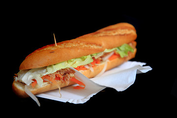 Image showing baguette on the black background