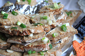 Image showing cracklings spreading with bread