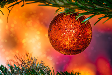 Image showing Glittering Christmas bauble in red color