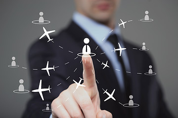 Image showing businessman clicks on the icon employee travel.