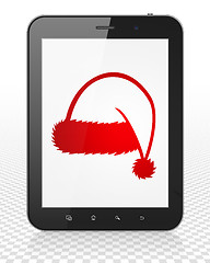 Image showing Holiday concept: Tablet Pc Computer with Christmas Hat on display