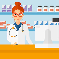 Image showing Pharmacist at counter with computer monitor.