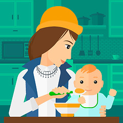 Image showing Woman feeding baby.