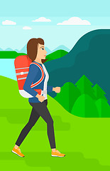 Image showing Woman with backpack hiking.