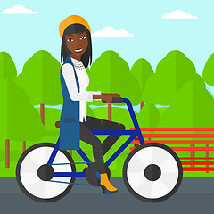 Image showing Woman riding bicycle.