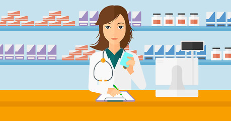 Image showing Pharmacist taking notes.