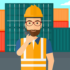 Image showing Stevedore standing on cargo containers background.