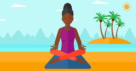 Image showing Woman meditating in lotus pose.