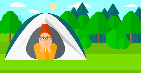 Image showing Woman lying in tent.