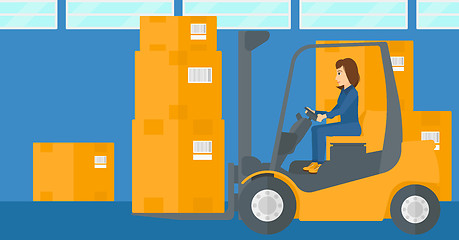 Image showing Warehouse worker moving load by forklift truck.