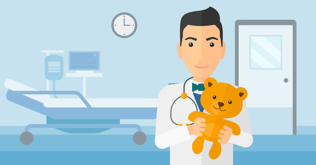 Image showing Pediatrician holding teddy bear.