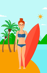 Image showing Surfer holding surfboard.