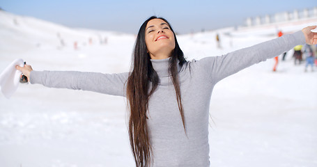 Image showing Young woman rejoicing in the winter weather