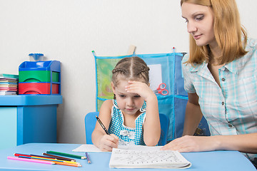 Image showing Five-year girl thought doing a spelling tutor
