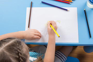 Image showing Five-year girl draws pencil on paper, top view