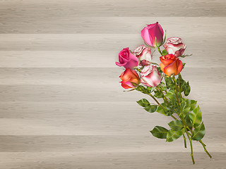 Image showing Red roses on a wooden background. EPS 10