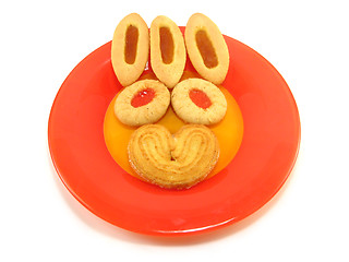 Image showing biscuit and tarts on a red plate
