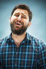 Image showing The crying man with tears on face closeup