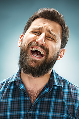 Image showing The crying man with tears on face closeup