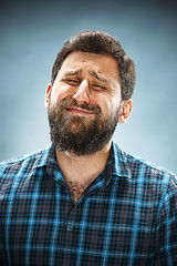 Image showing The crying man with tears on face closeup