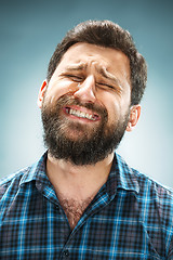 Image showing The crying man with tears on face closeup