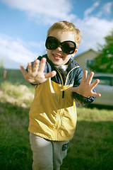 Image showing Happy boy in big sunglasses outdoor