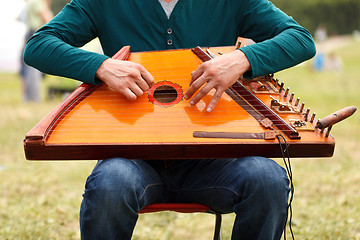 Image showing Folk musician playing gusli