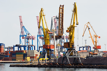 Image showing Industrial cranes and cargo on a quay