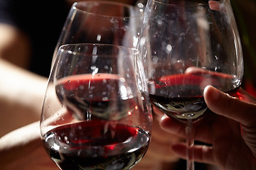 Image showing Three red wine glasses.