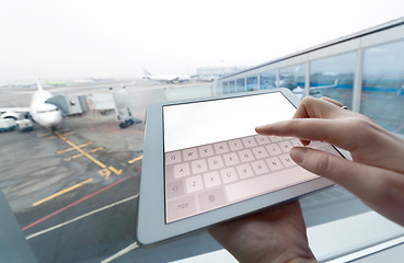 Image showing Woman with tablet computer empty screen at airport